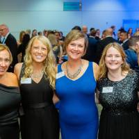 Group of girls posing in the Laker Lounge after Enrichment